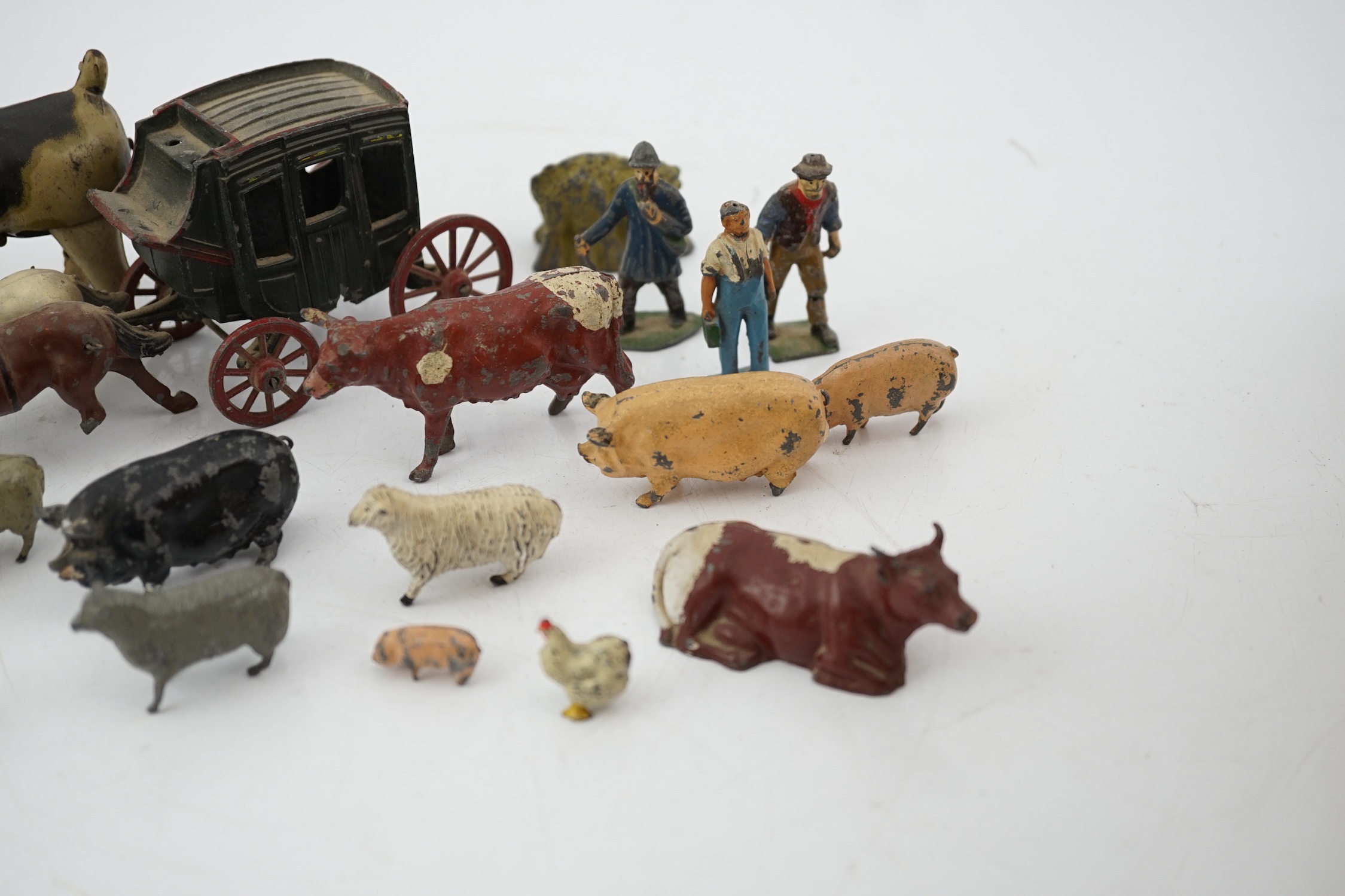 A collection of Britains, etc. lead farm animals and accessories, including the farmer, farmer’s wife, a coach and horses and other figures